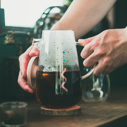 Get the Pong's OHTEAVOR POT is a hand-blown borosilicate glass tea and coffee pot. It features a patent-pending swirling design, a water level indicator, temperature control, and a silicone lid.