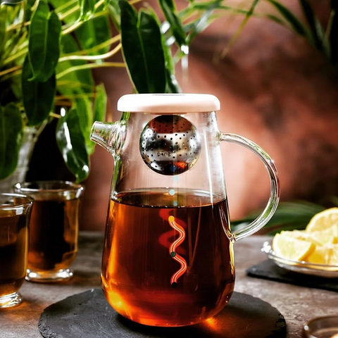 Get the Pong's OHTEAVOR POT is a hand-blown borosilicate glass tea and coffee pot. It features a patent-pending swirling design, a water level indicator, temperature control, and a silicone lid.