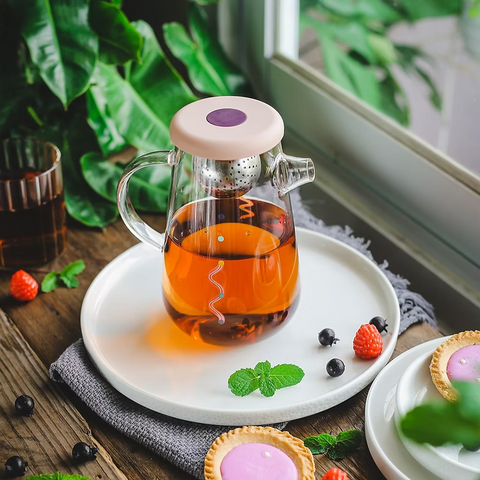 Get the Pong's OHTEAVOR POT is a hand-blown borosilicate glass tea and coffee pot. It features a patent-pending swirling design, a water level indicator, temperature control, and a silicone lid.