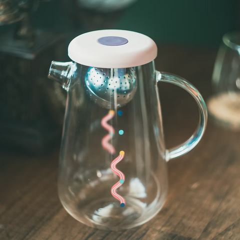 Get the Pong's OHTEAVOR POT is a hand-blown borosilicate glass tea and coffee pot. It features a patent-pending swirling design, a water level indicator, temperature control, and a silicone lid.