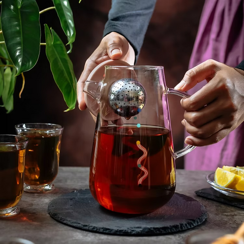 Get the Pong's OHTEAVOR POT is a hand-blown borosilicate glass tea and coffee pot. It features a patent-pending swirling design, a water level indicator, temperature control, and a silicone lid.